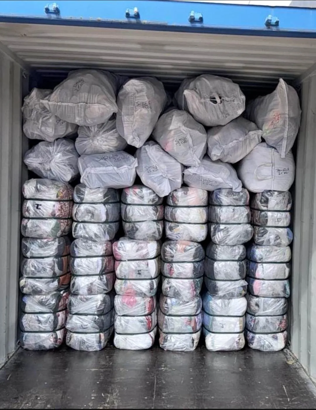 A shipping container loaded with export bales, ready to go
